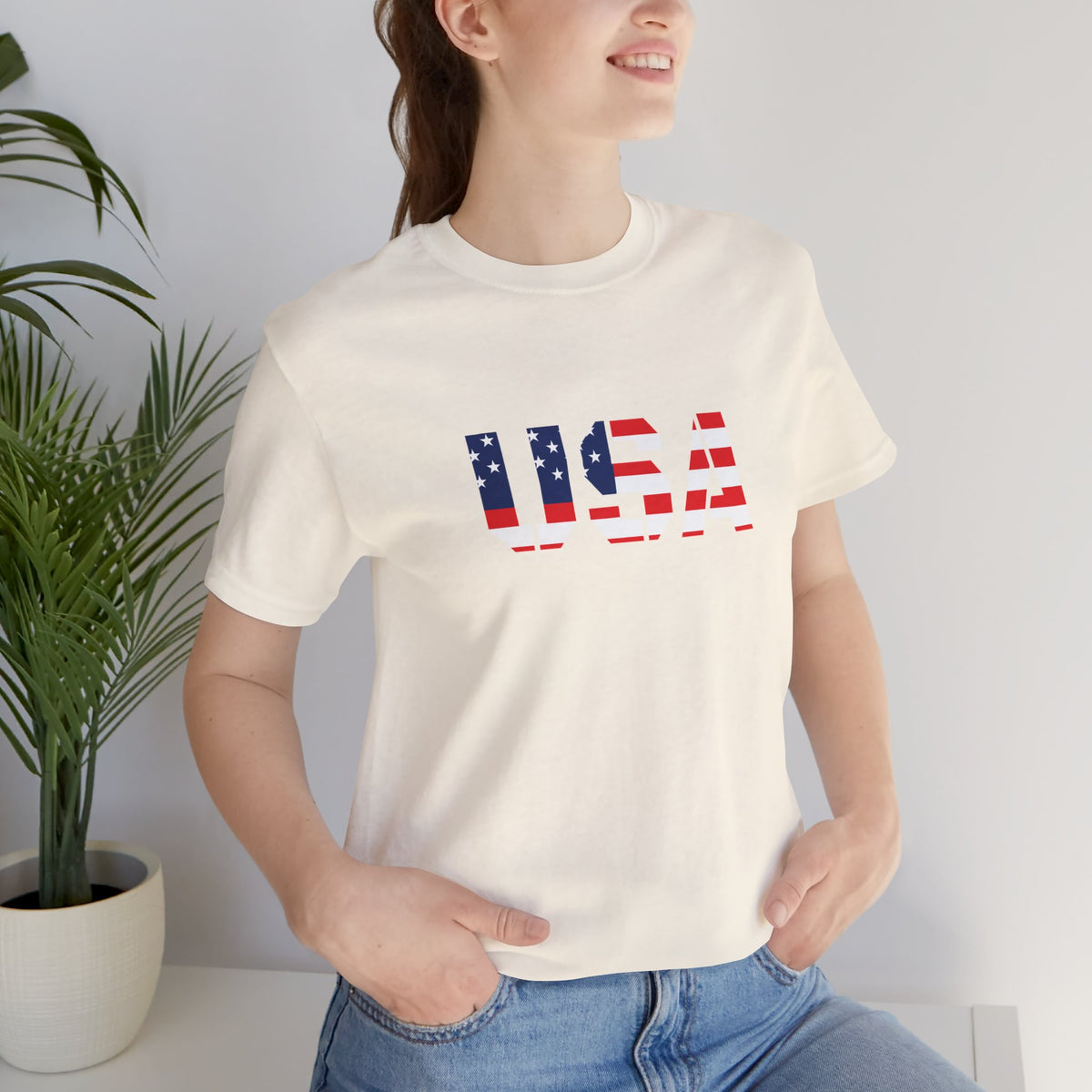 USA flag patriotic T-shirt featuring bold red, white, and blue colors with "USA" text, perfect for Fourth of July celebrations.
