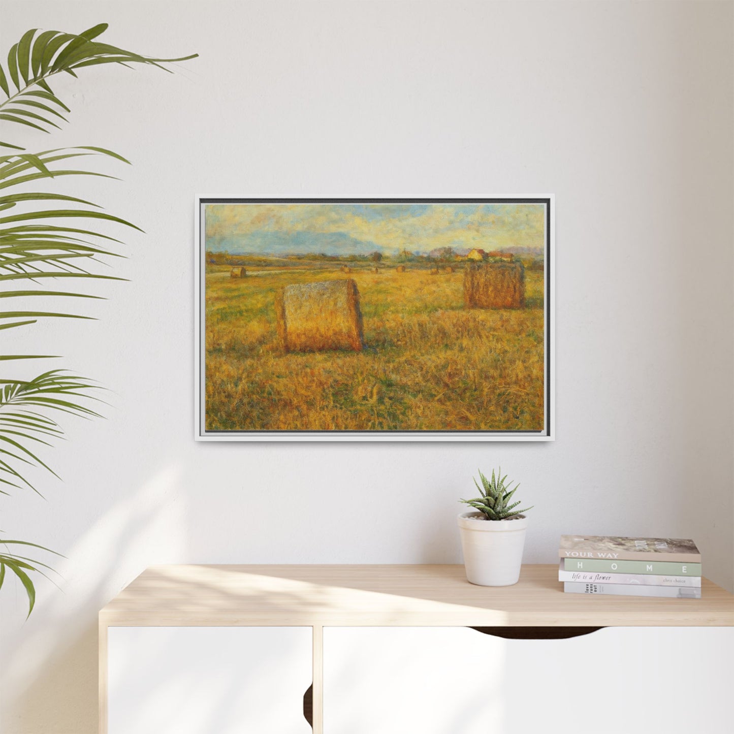 Framed matte canvas wall art featuring a rustic hayfield landscape print, showcasing a peaceful countryside scene.