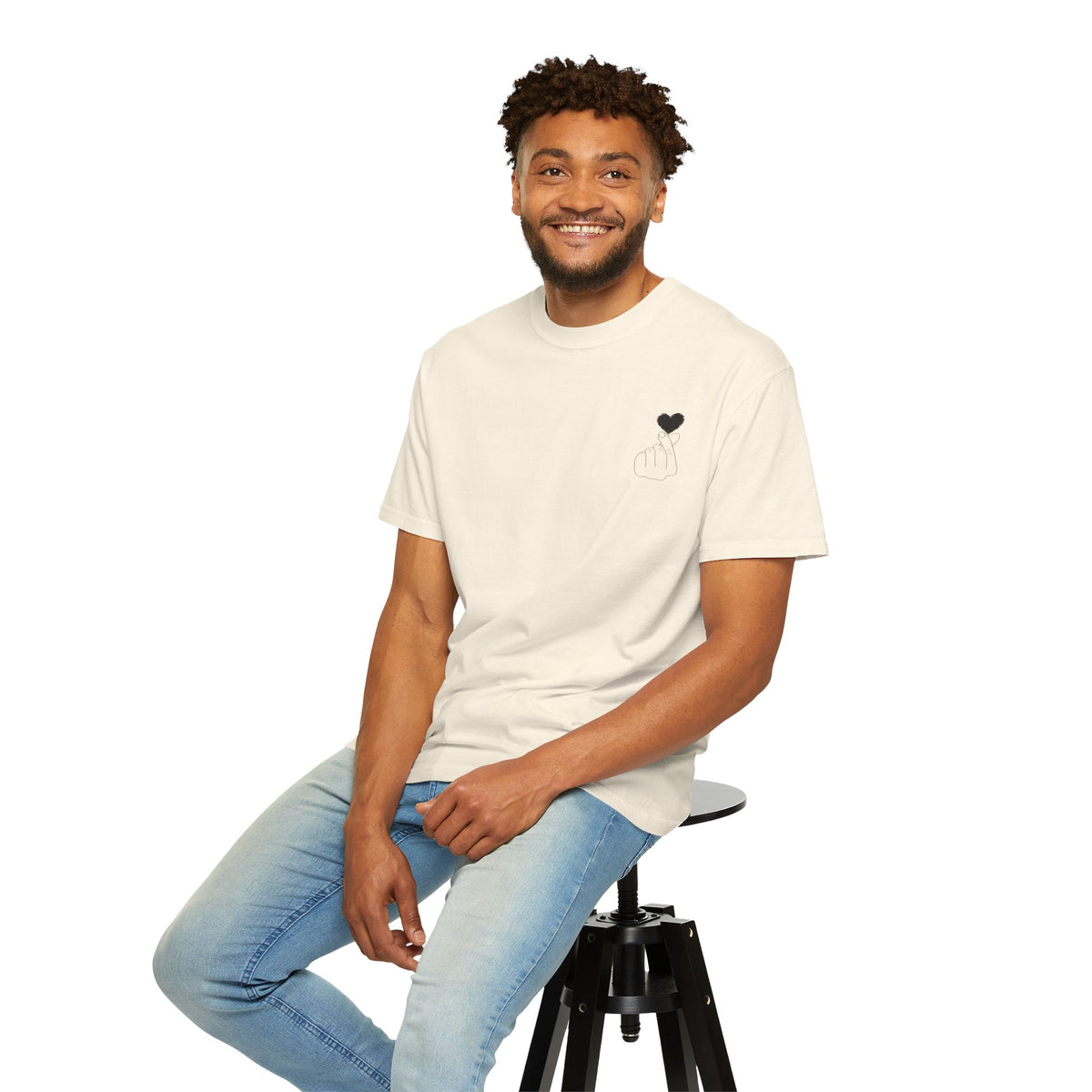 Minimal black finger heart graphic T-shirt by Printify featuring a simple heart design on a black cotton tee.