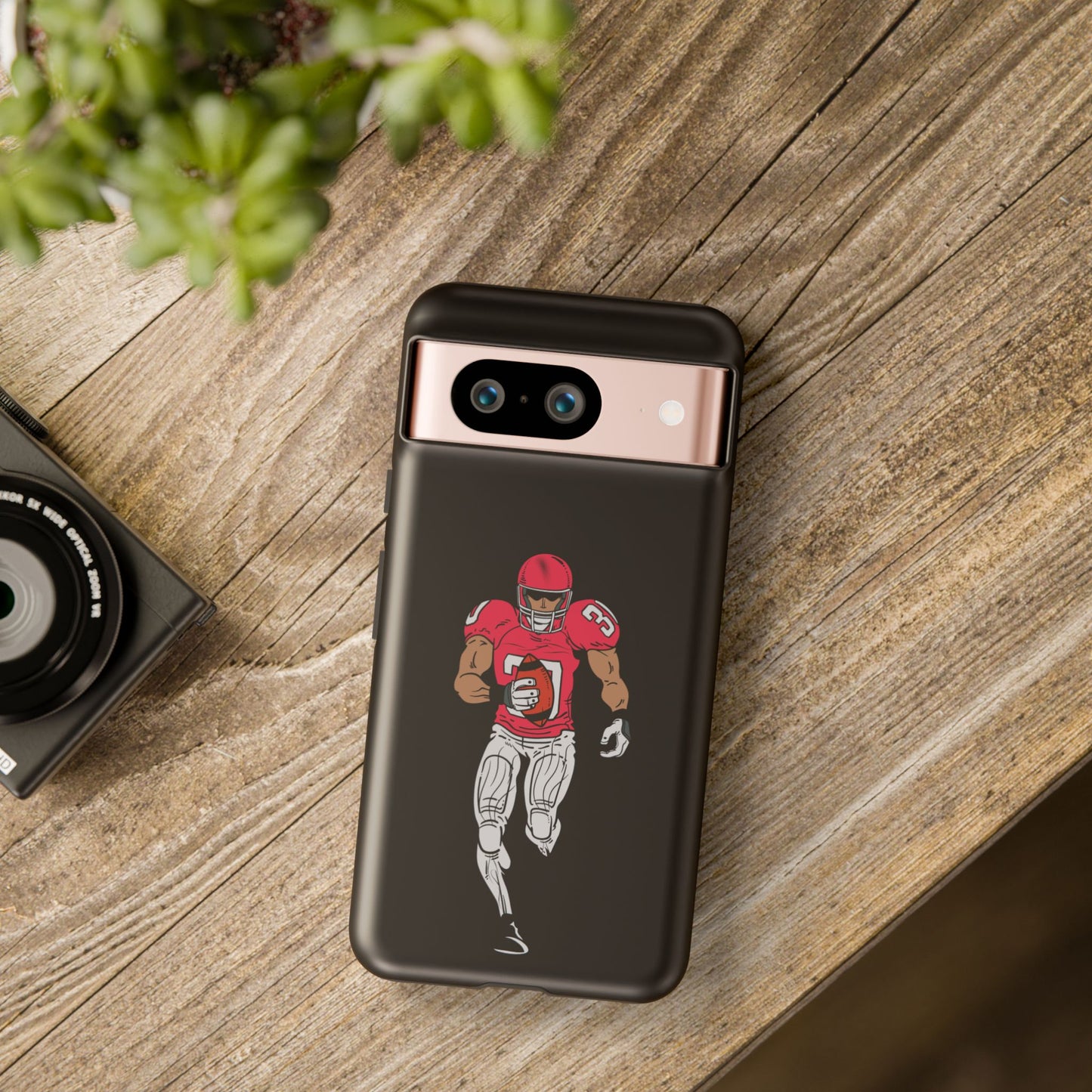 Black protective football player sports phone case for iPhone, featuring a tough design by Printify.