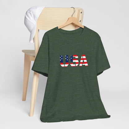 USA flag text T-shirt by Printify featuring patriotic Fourth of July design, with red, white, and blue colors and bold lettering.
