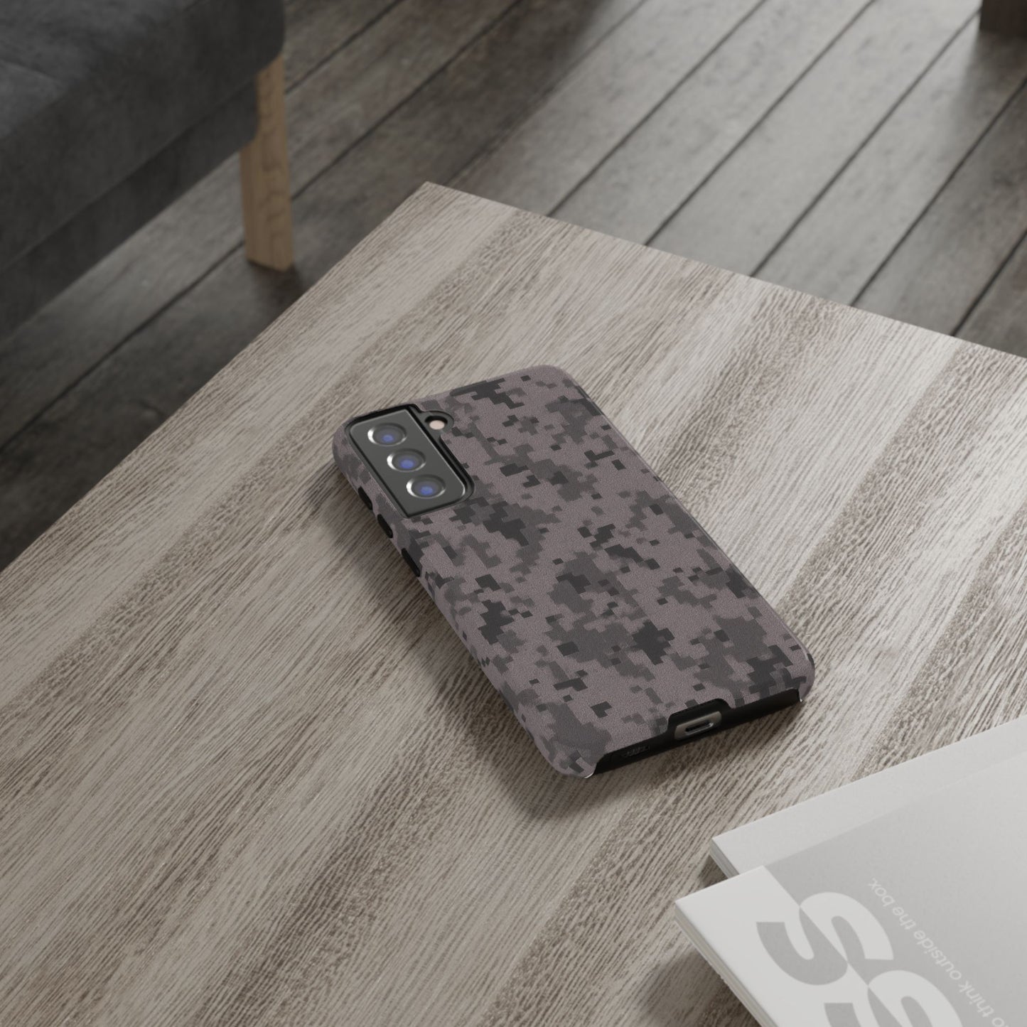 Gray digital camouflage phone case by Printify, showing a tough protective cover with a digital camo pattern on a smartphone.