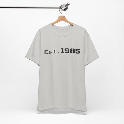 Vintage Est. 1985 graphic T-shirt by Printify featuring retro year design and casual fit.