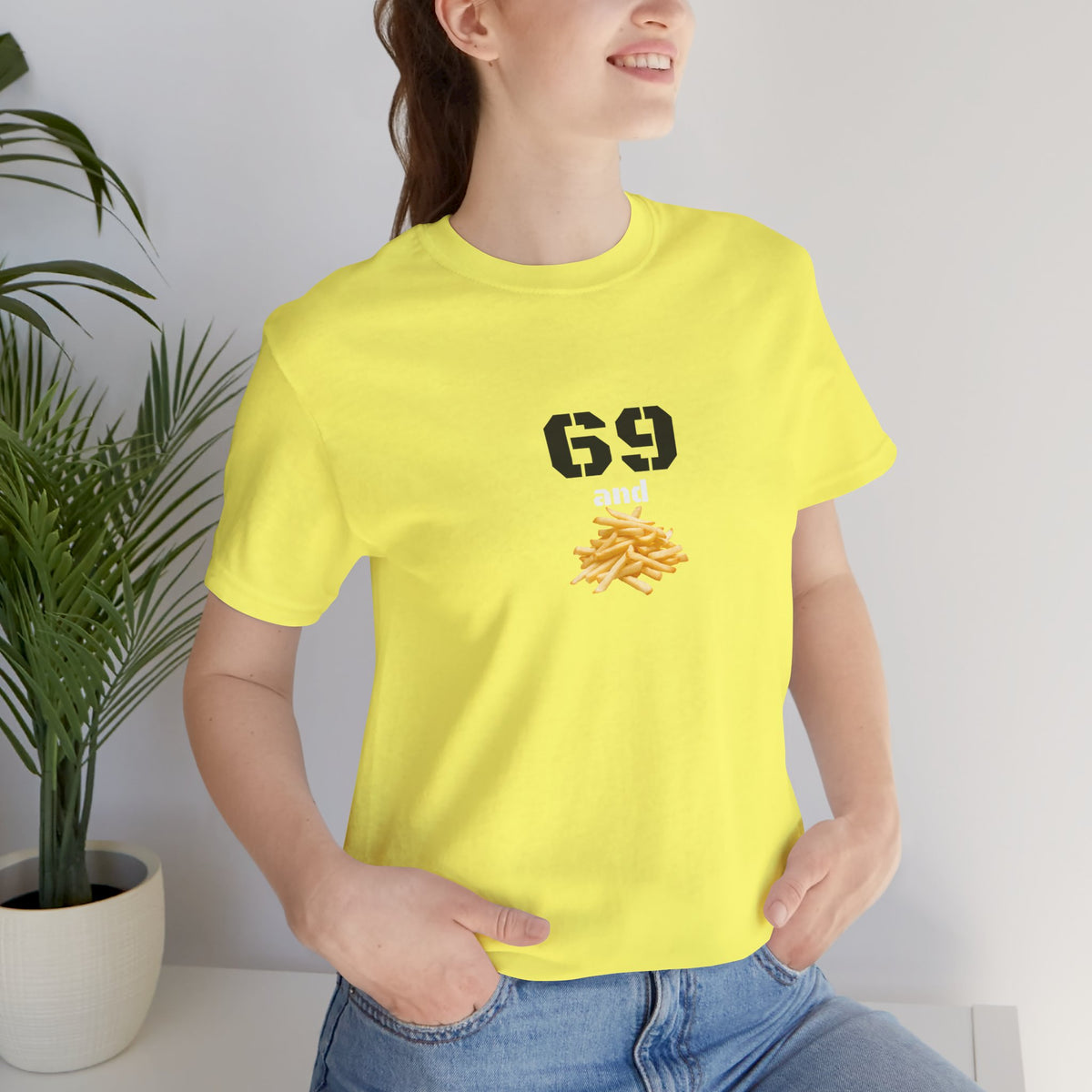Unisex graphic T-shirt featuring humorous "69 & French Fries" design in black on a white background, casual and fun apparel.