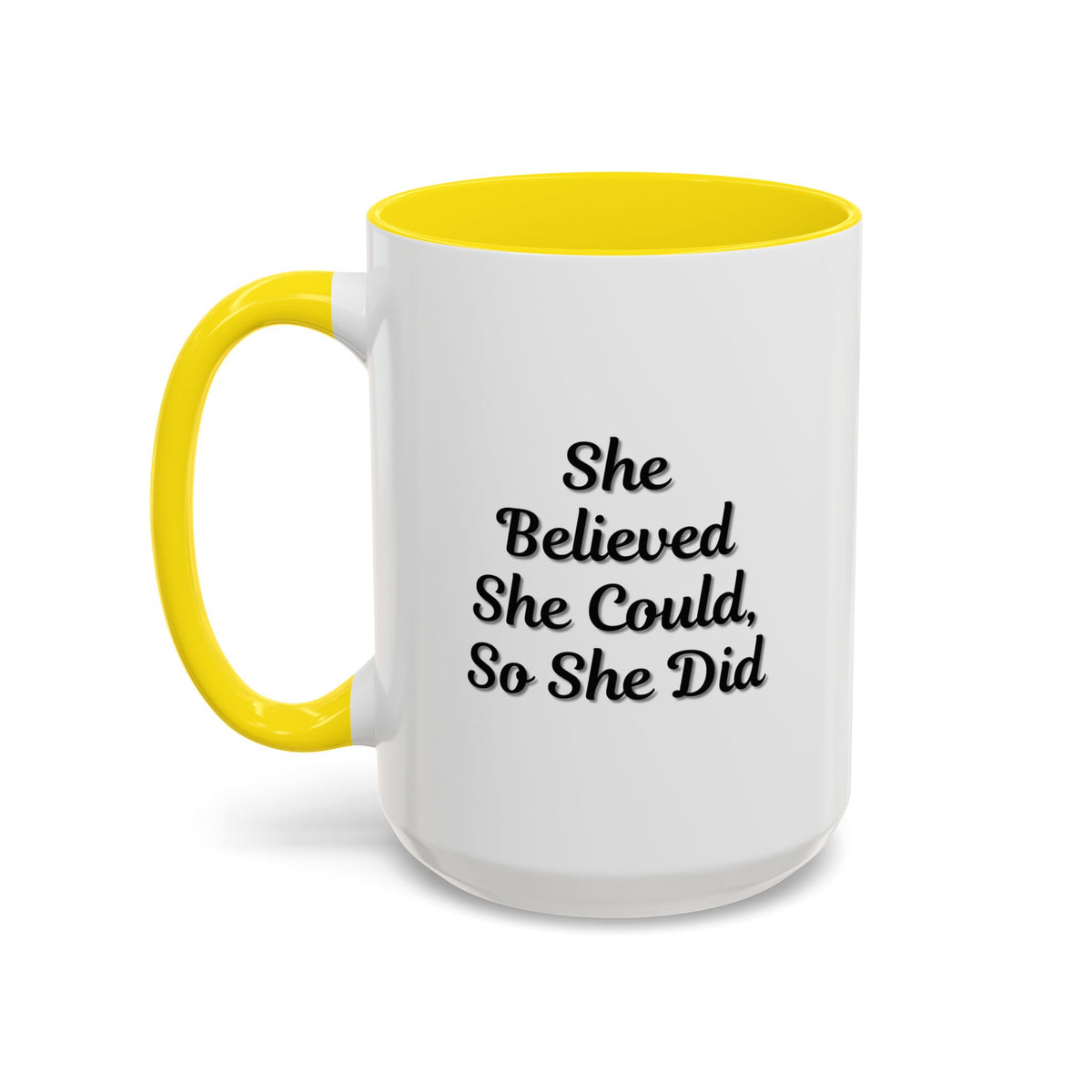 White ceramic motivational coffee mug with black text reading "She Believed She Could, So She Did" on a plain background.