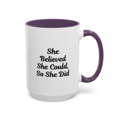 Motivational coffee mug with the quote "She Believed She Could, So She Did" in black text on a white ceramic mug.