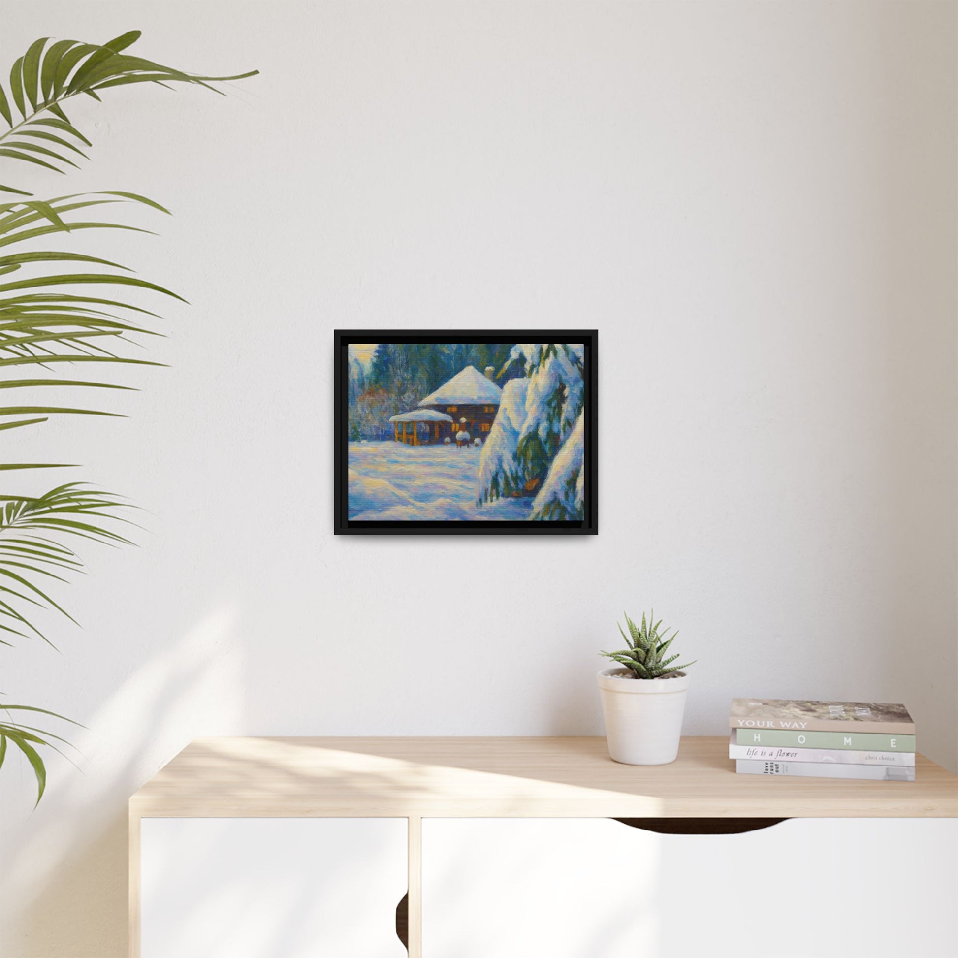 Framed matte canvas print of a snowy cabin winter landscape wall art by Printify, featuring a cozy cabin surrounded by snow.