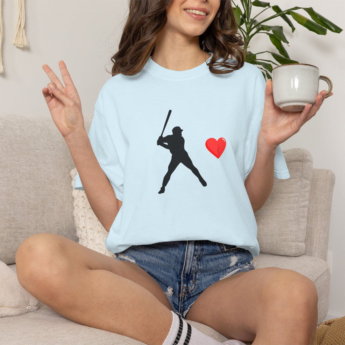 Printify baseball batter heart T-shirt showing a graphic of a baseball player swinging a bat on a white fabric background.