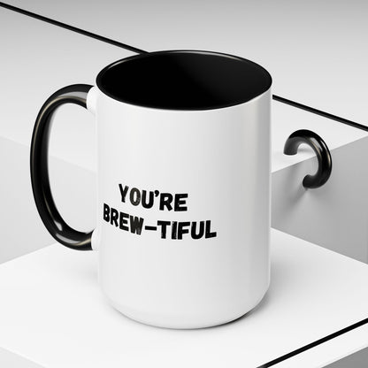 You’re Brew-tiful Coffee Mug – Cute Coffee Pun Accent Mug (11/15oz) — white ceramic accent mug with glossy finish and bold black “YOU’RE BREW-TIFUL” print, styled product photo