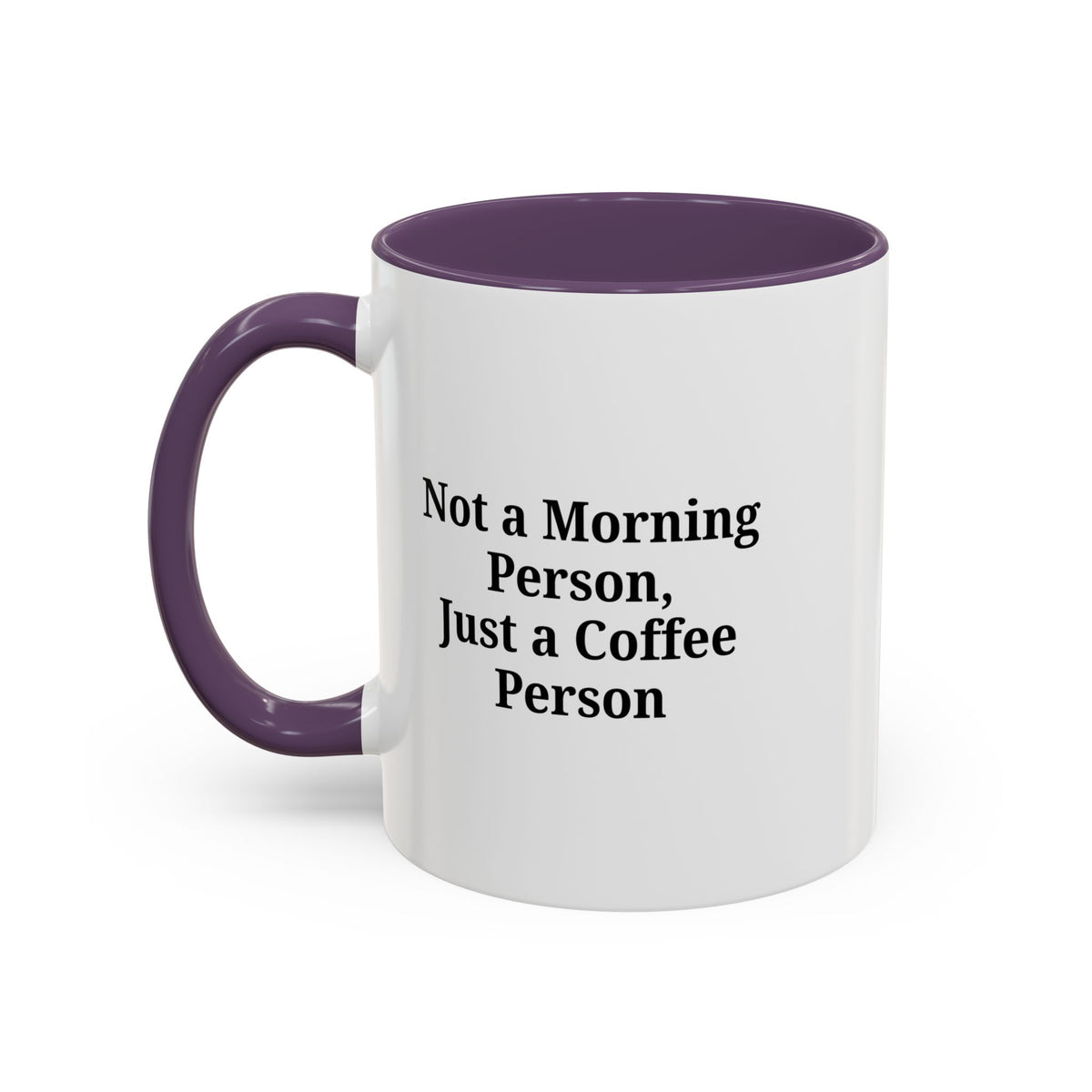 Ceramic coffee mug with "Not a Morning Person, Just a Coffee Person" print, featuring a white background and colorful text.