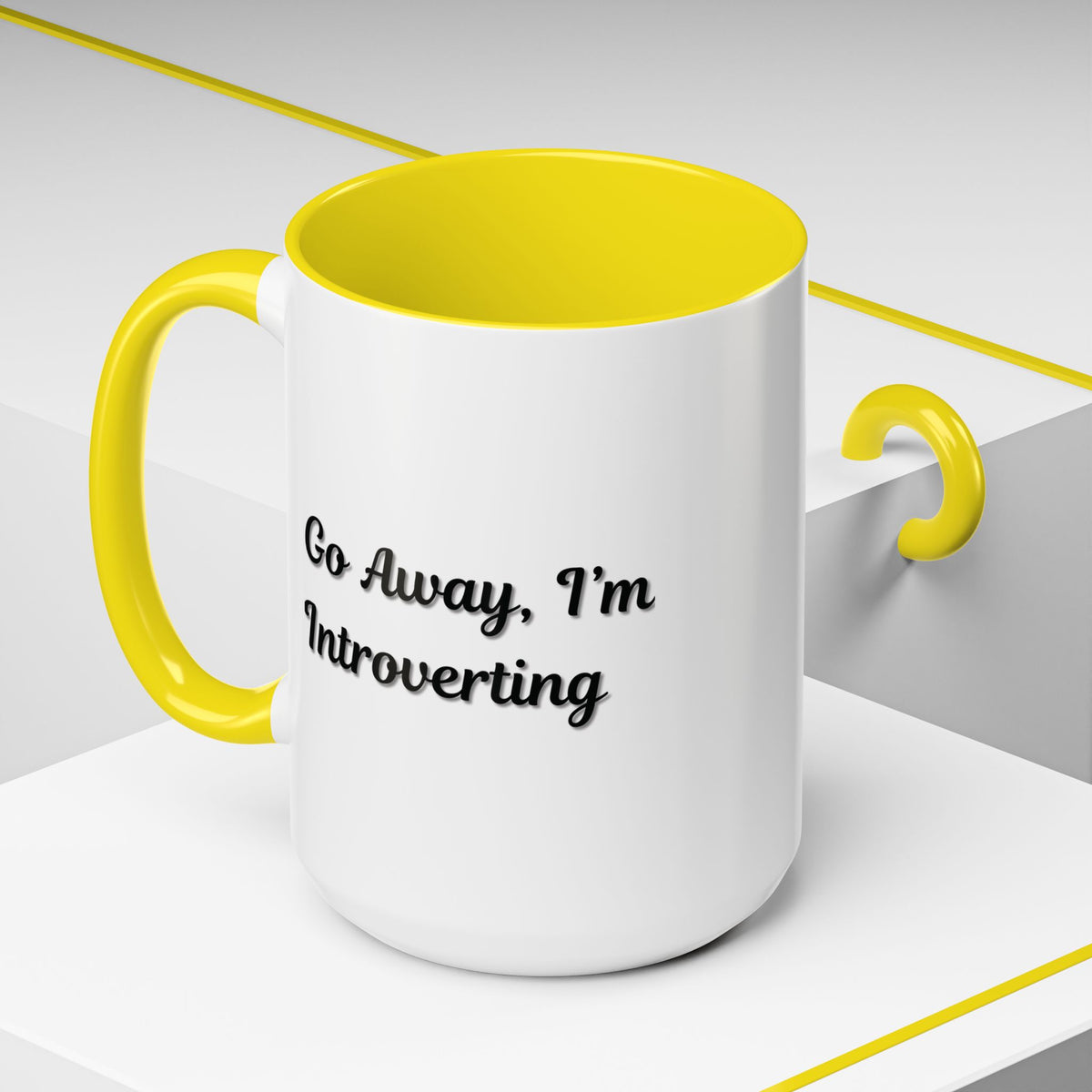 Ceramic coffee mug with "Go Away, I'm Introverting" slogan, 11 oz size, featuring a white background and black text.