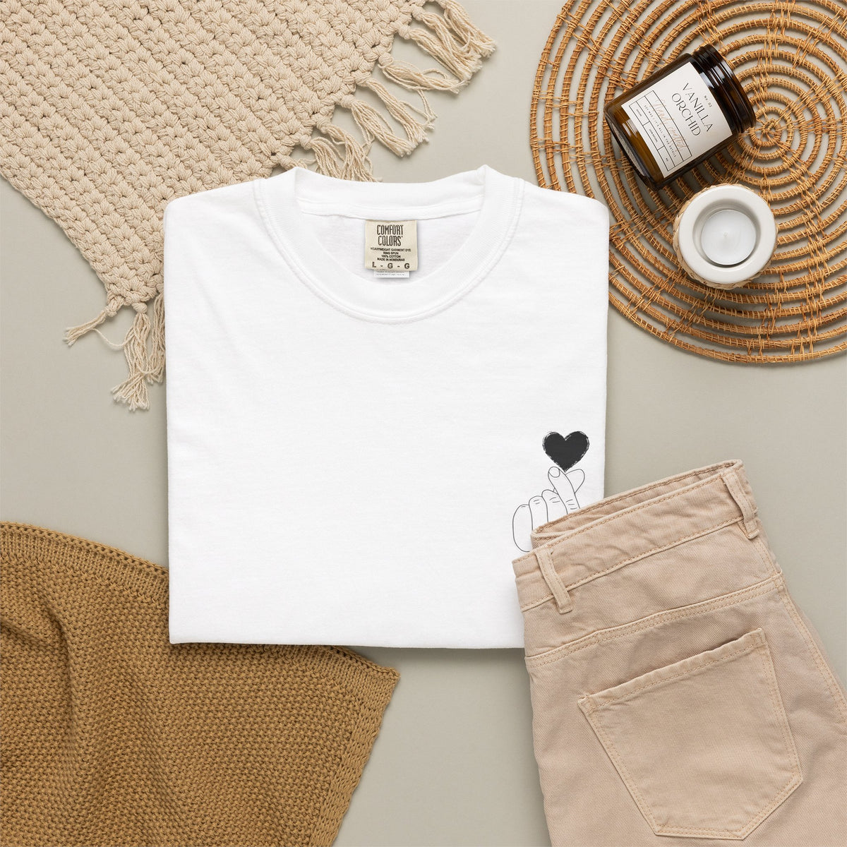 Black T-shirt with minimal white finger heart graphic, casual style, from Printify, featuring a simple heart design on the front.