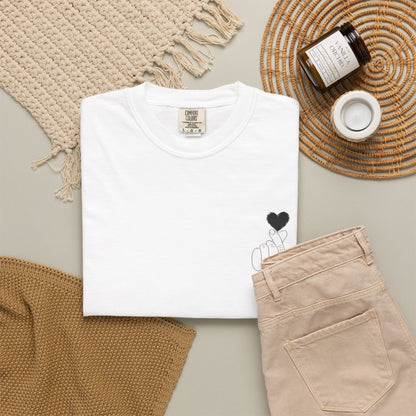 Black T-shirt with minimal white finger heart graphic, casual style, from Printify, featuring a simple heart design on the front.