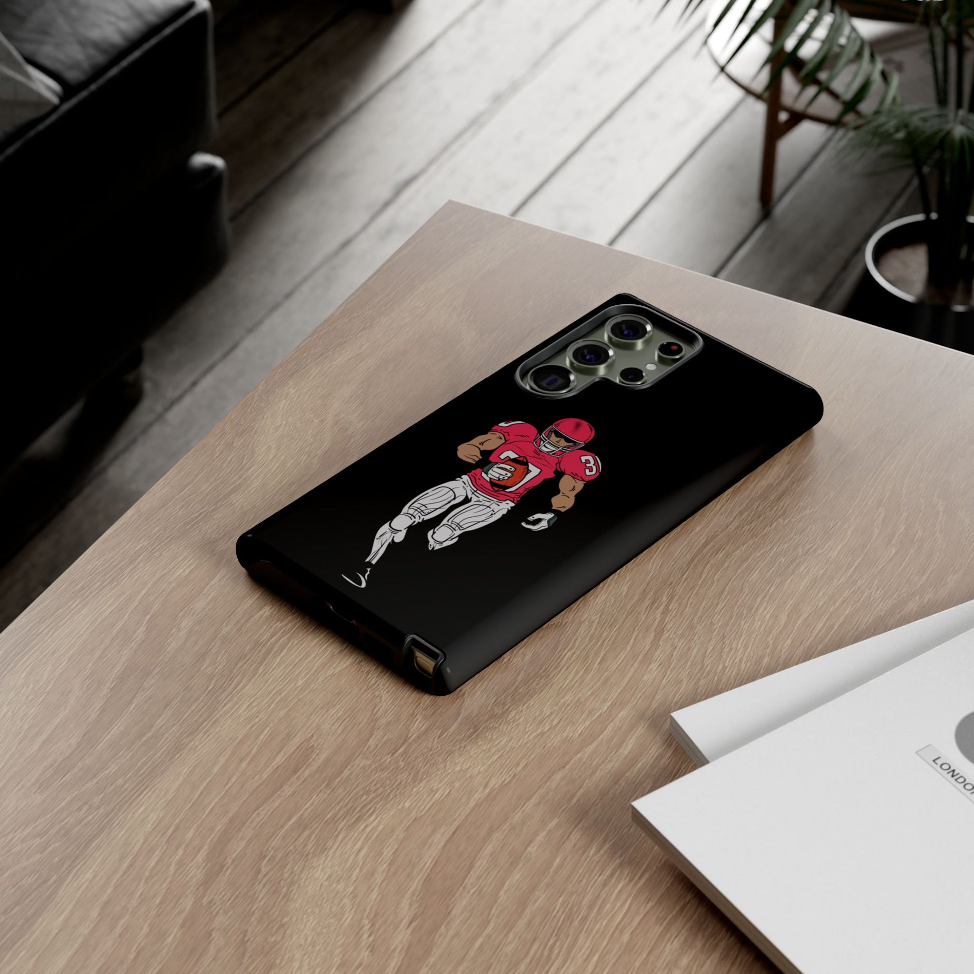 Black Printify football player tough phone case for iPhone, featuring sports graphics and protective design.