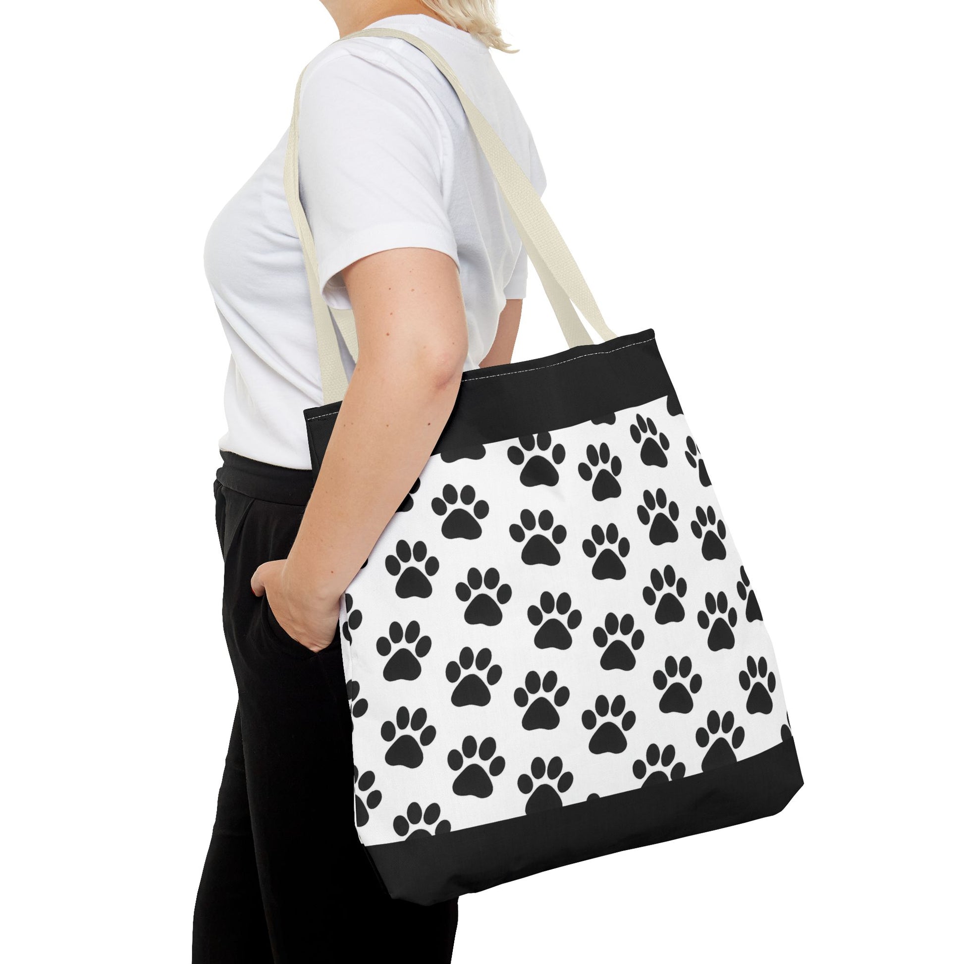 Eco-friendly tote bag with paw print design, ideal for dog and cat lovers, made by Printify, perfect for carrying essentials.