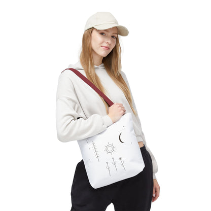 Minimal moon and sun botanical tote bag with celestial line art design, featuring a natural canvas material and sturdy handles.