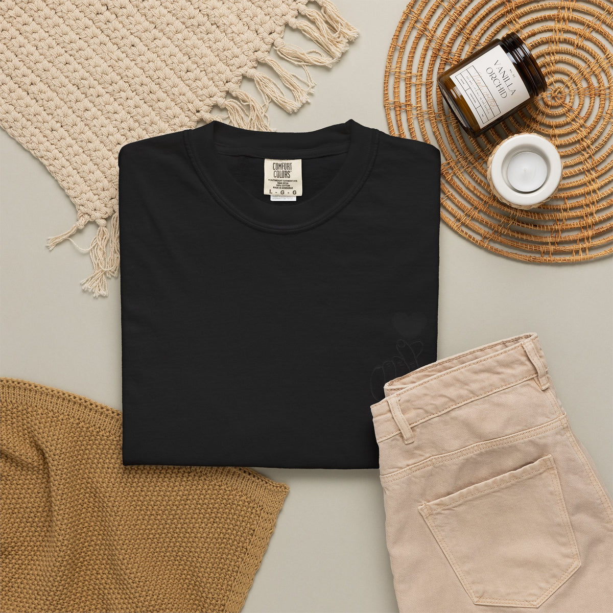 Black T-shirt with minimal white finger heart graphic, casual style, from Printify, displayed on a flat surface.