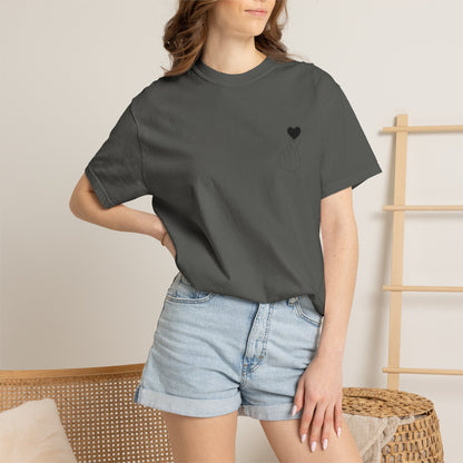 Black T-shirt with a minimal white finger heart graphic design, made by Printify, showcasing a casual graphic tee style.