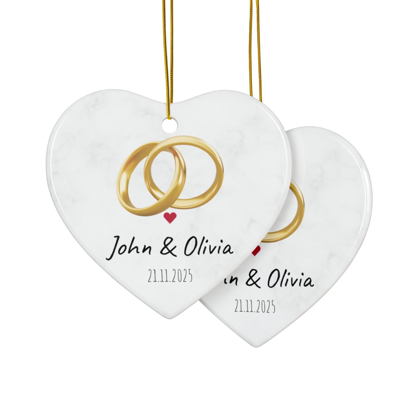 Round ceramic wedding rings ornament with personalized names and date, decorative keepsake for special occasions.