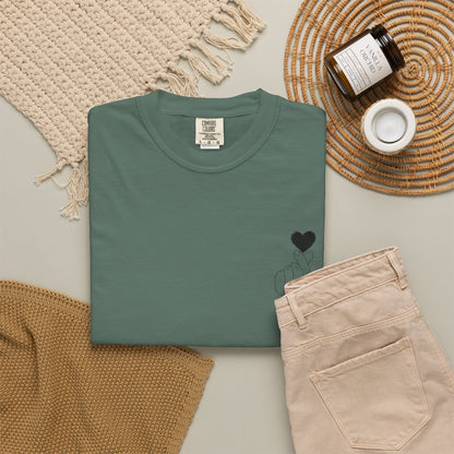 Black T-shirt featuring a minimal white finger heart graphic, ideal for casual wear and stylish fashion statements.