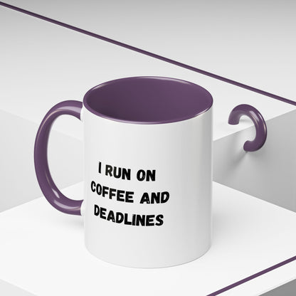White ceramic mug with "I Run on Coffee and Deadlines" print, featuring black text and a curved handle.