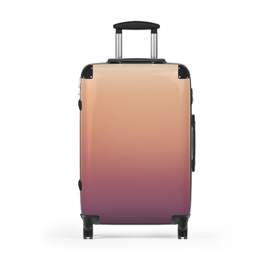 Gradient ombre carry-on suitcase in sunset pink to plum by Printify, featuring a stylish travel luggage design.