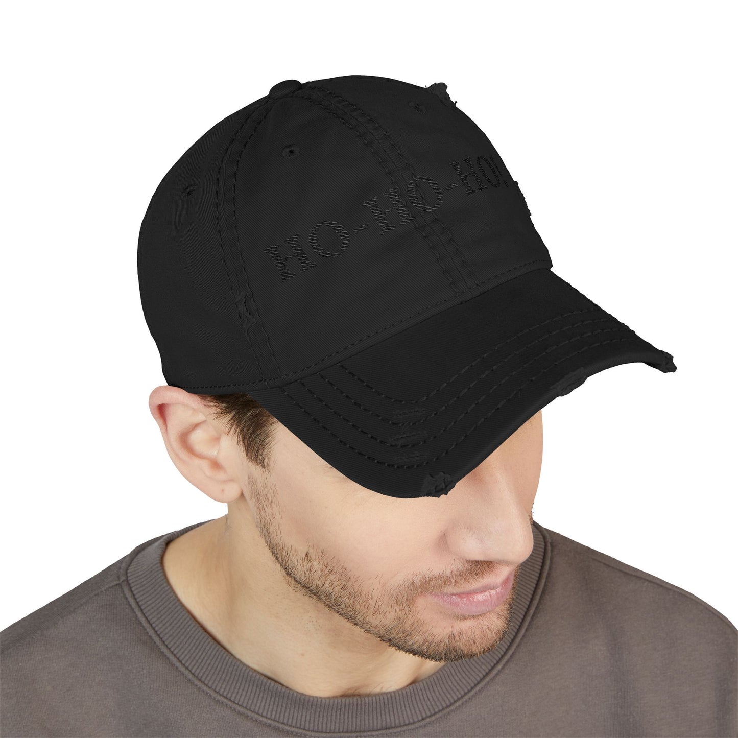 Distressed embroidered "HO-HO-HO" dad hat by Printify, featuring a casual baseball cap design with festive holiday lettering.