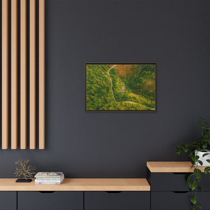 Colorful framed matte canvas wall art featuring an aerial view of a forest path landscape by Printify.