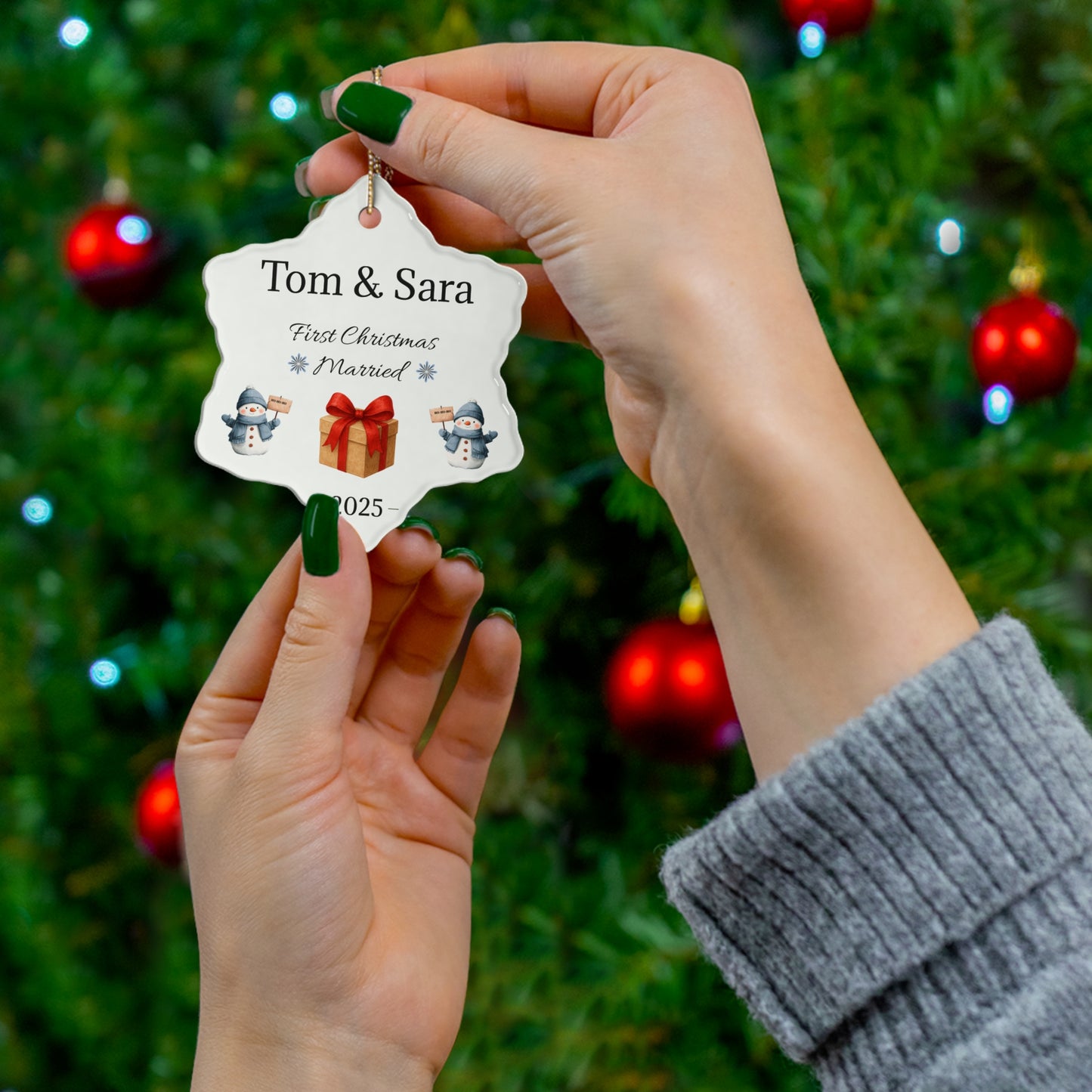 Personalized ceramic ornament with "Tom & Sara First Christmas Married 2025" inscription, featuring a festive holiday design.