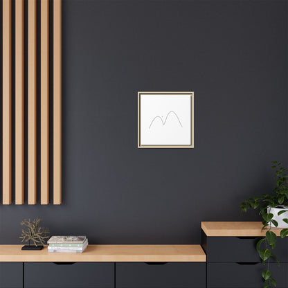Minimalist mountain line art on framed matte canvas by Printify, showcasing simple mountain peaks in black ink on white background.