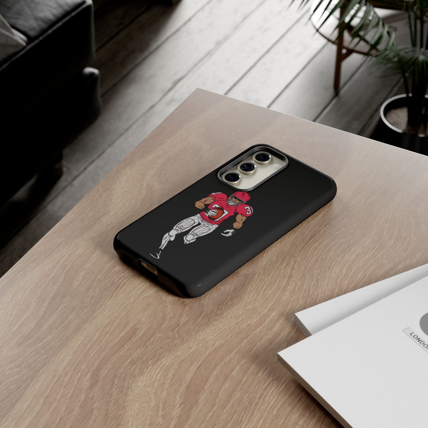 Black football player tough phone case for iPhone, featuring sports design and durable protective material by Printify.
