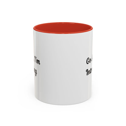 Ceramic coffee mug with "Go Away, I'm Introverting" slogan, 11 oz size, white with black text, ideal for introverts.