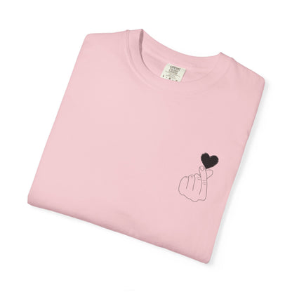 Minimal black heart graphic T-shirt by Printify featuring a finger heart design on a classic black tee.