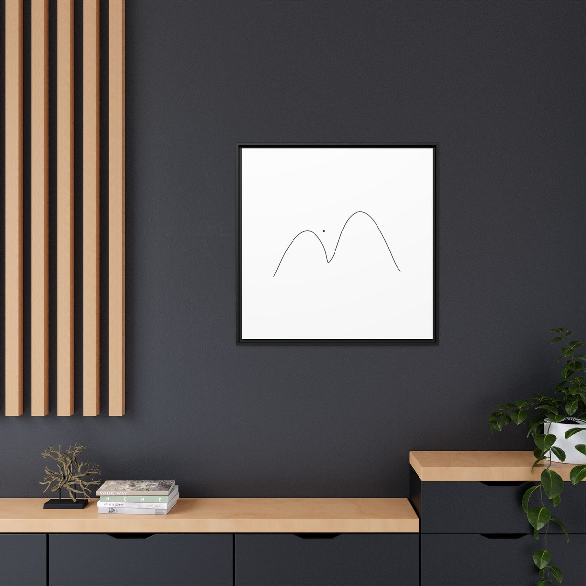 Minimalist mountain line art printed on framed matte canvas, showcasing simple mountain peaks in black ink.