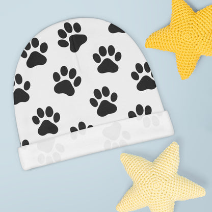Black paw print baby beanie with animal paw pattern, soft infant hat featuring all-over print design by Printify.