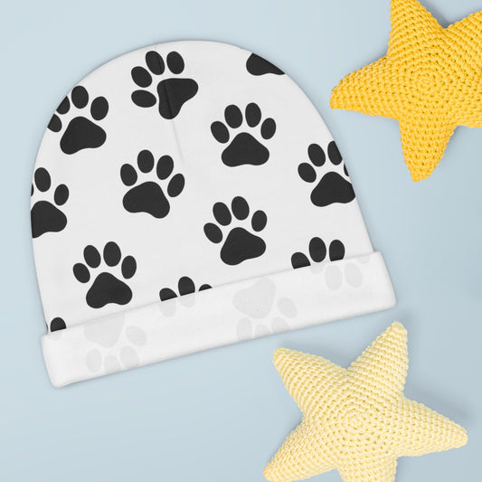 Black paw print baby beanie with animal paw pattern, soft infant hat featuring all-over print design by Printify.