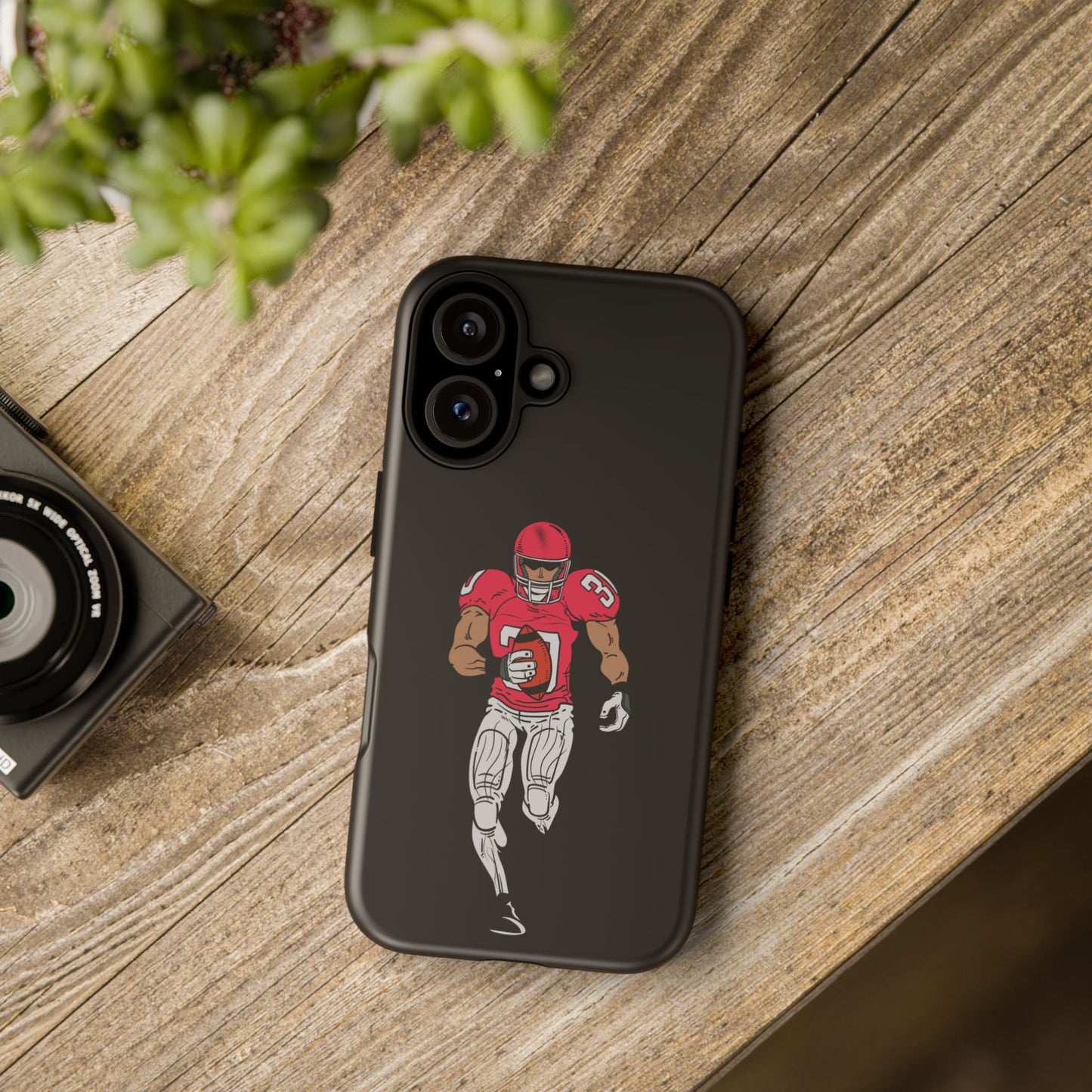 Black football player tough phone case for iPhone, protective sports accessory with printed sports design by Printify.