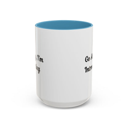 Ceramic coffee mug with "Go Away, I'm Introverting" text in black on white, 11 oz size, featuring a simple, minimalist design.