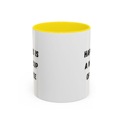 White ceramic coffee mug with "Happiness Is A Warm Cup Of Coffee" quote, featuring a simple, modern design.