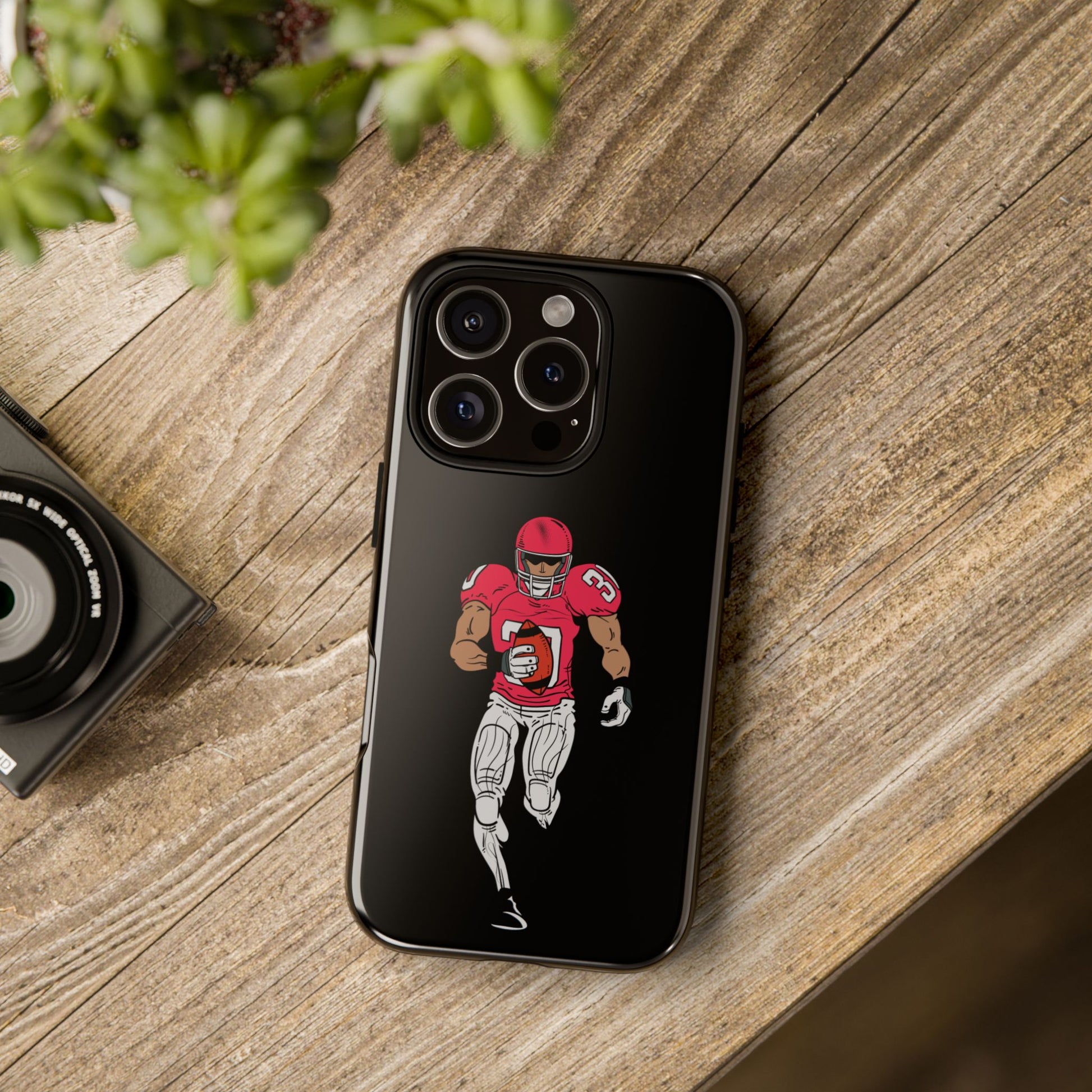 Black football player tough phone case for iPhone, protective sports-themed design by Printify, featuring a dynamic athlete image.