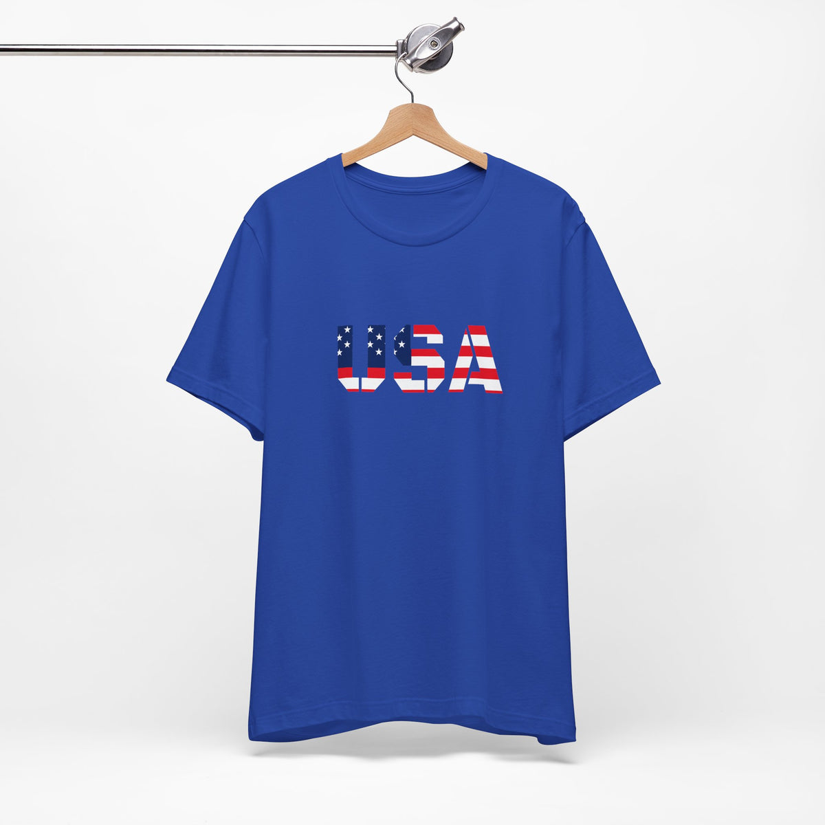 USA flag text T-shirt by Printify featuring patriotic design, perfect for Fourth of July celebrations, shown on a model.