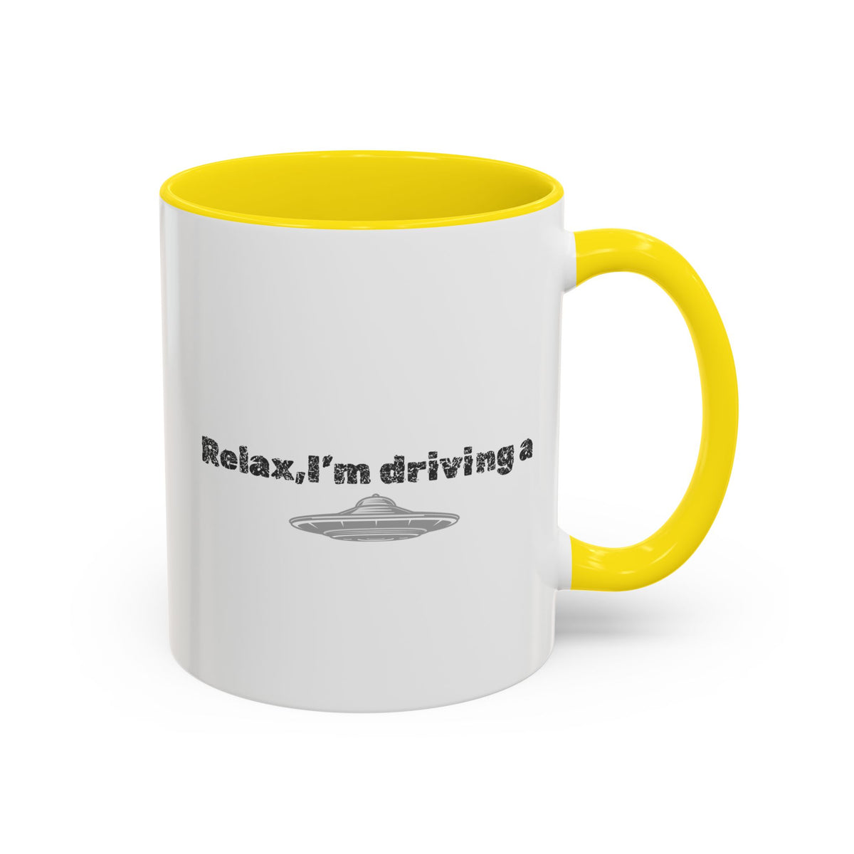 Ceramic coffee mug with "Relax, I’m Driving" UFO accent design, 11 oz, white mug with colorful space-themed graphics.