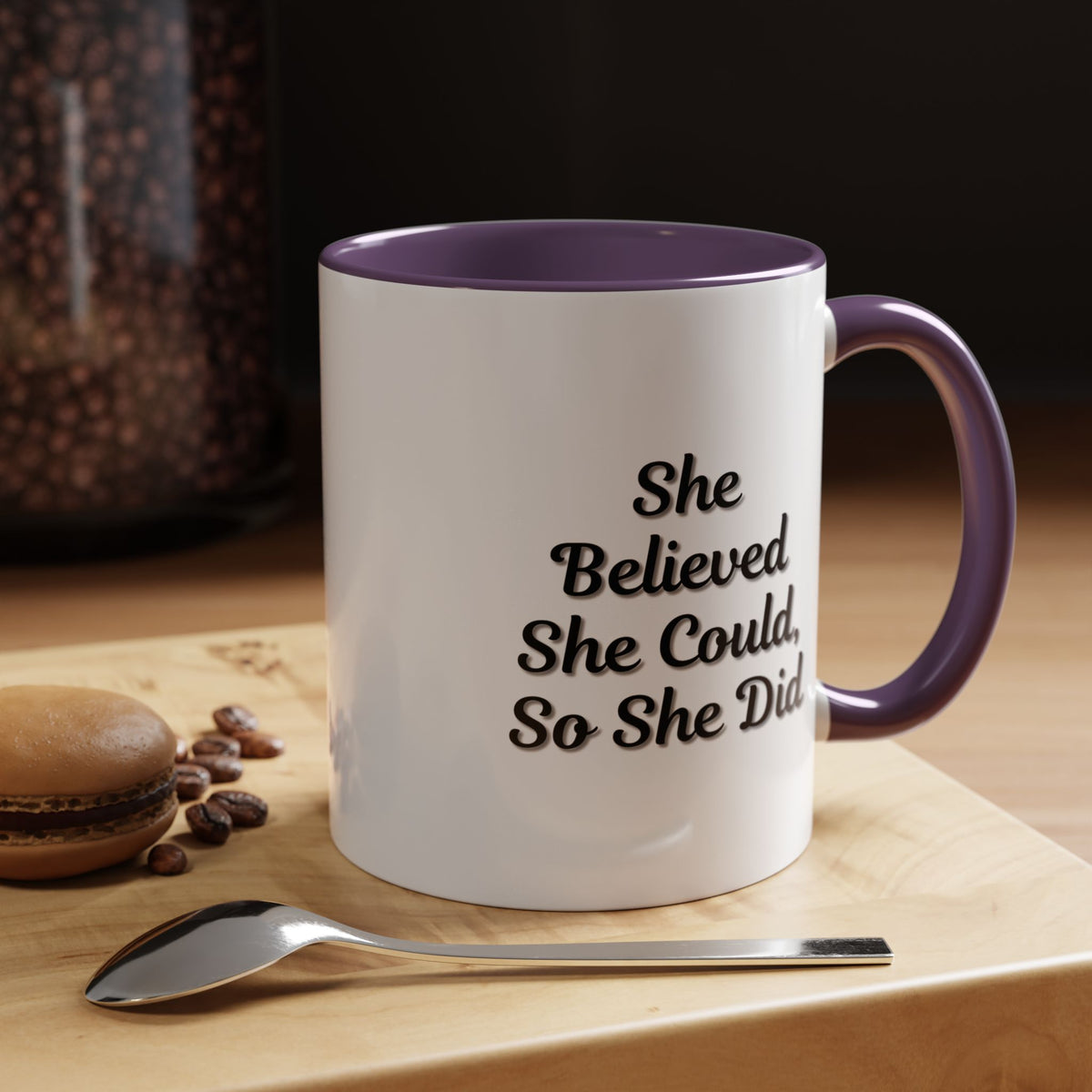 Ceramic motivational coffee mug with the phrase "She Believed She Could, So She Did" printed in black lettering.