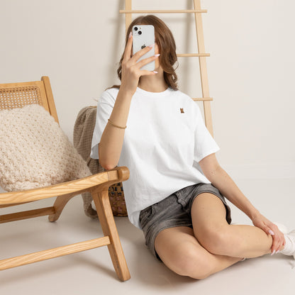 Cute brown kitten graphic t-shirt for cat lovers, featuring a playful feline design on a comfortable Printify T-shirt.