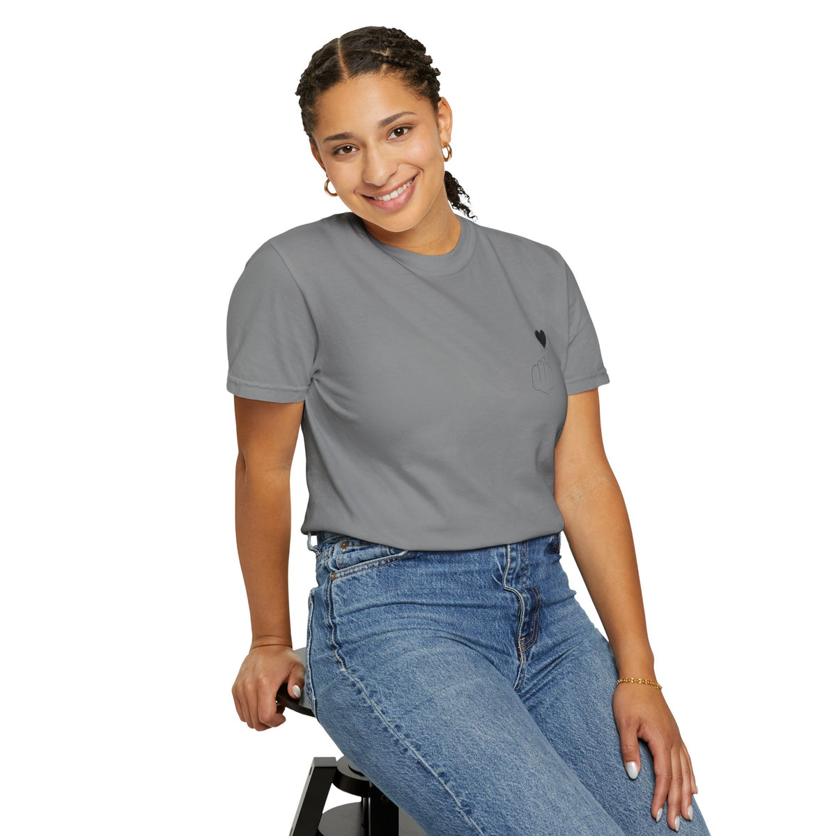 Black T-shirt with a minimal white finger heart graphic, casual Fit, by Printify, displayed on a plain background.