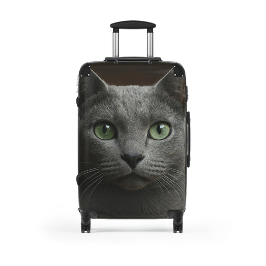 Photo of a green-eyed cat face carry-on suitcase with realistic cat face design, ideal for travel bags.