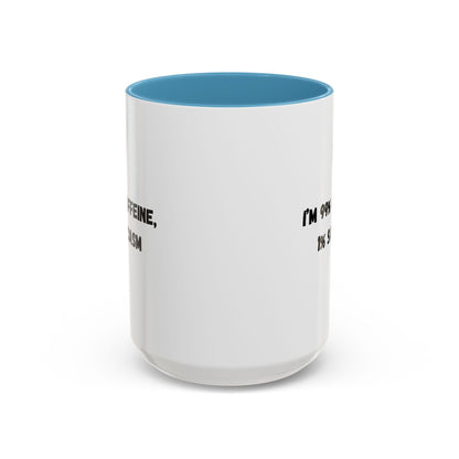Ceramic coffee mug with "I'm 99% Caffeine, 1% Sarcasm" text, featuring a white background and black lettering.