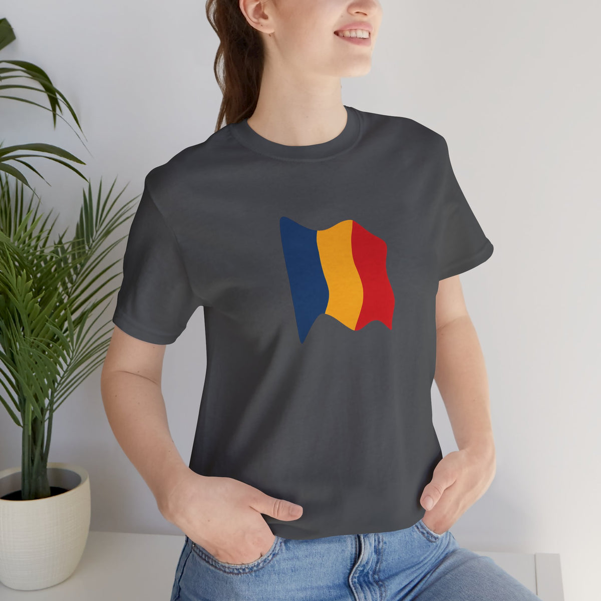 Romania flag T-shirt by Printify featuring a minimal waving tricolor design on a casual T-shirt.