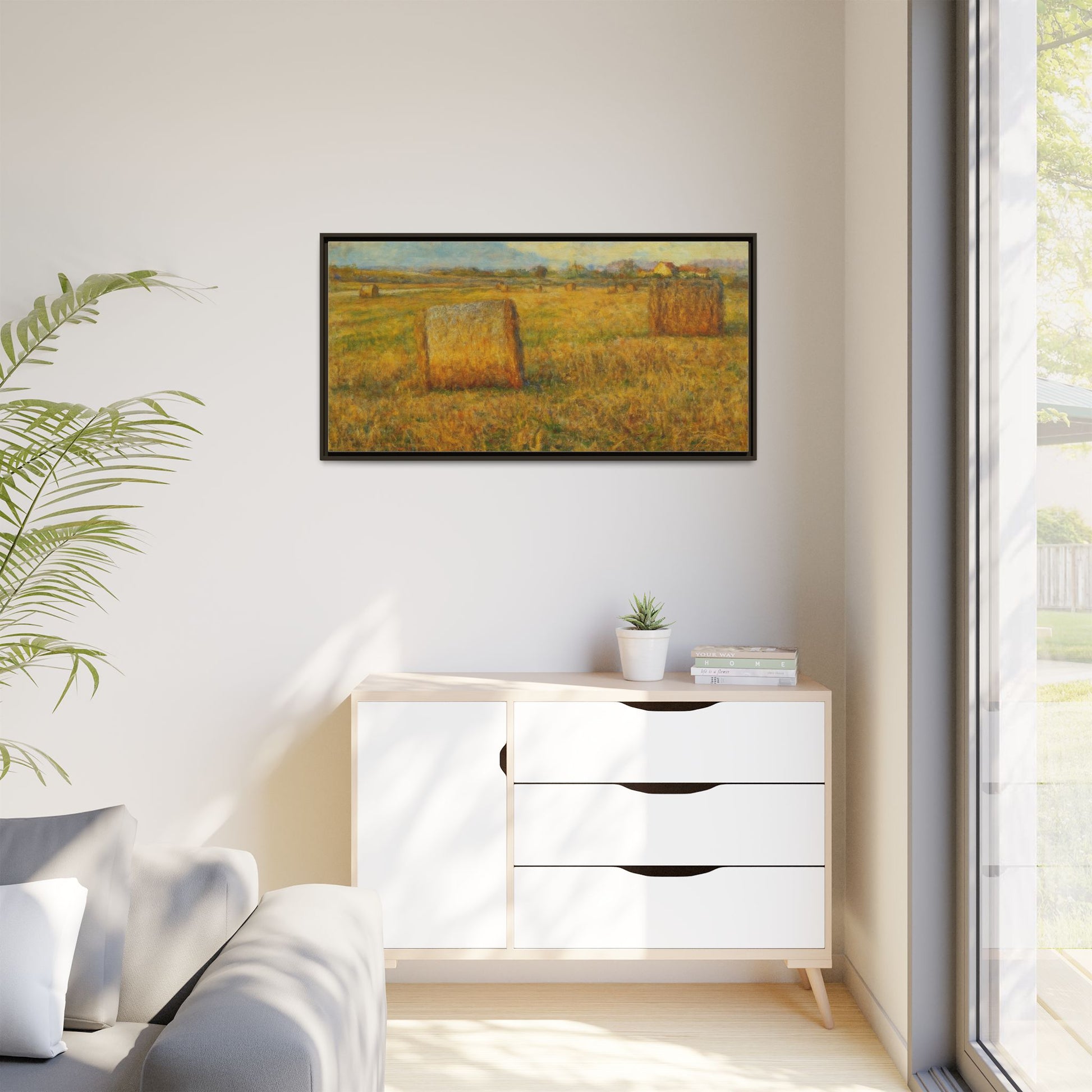 Framed matte canvas wall art featuring a rustic hayfield landscape print by Printify, showcasing natural countryside scenery.
