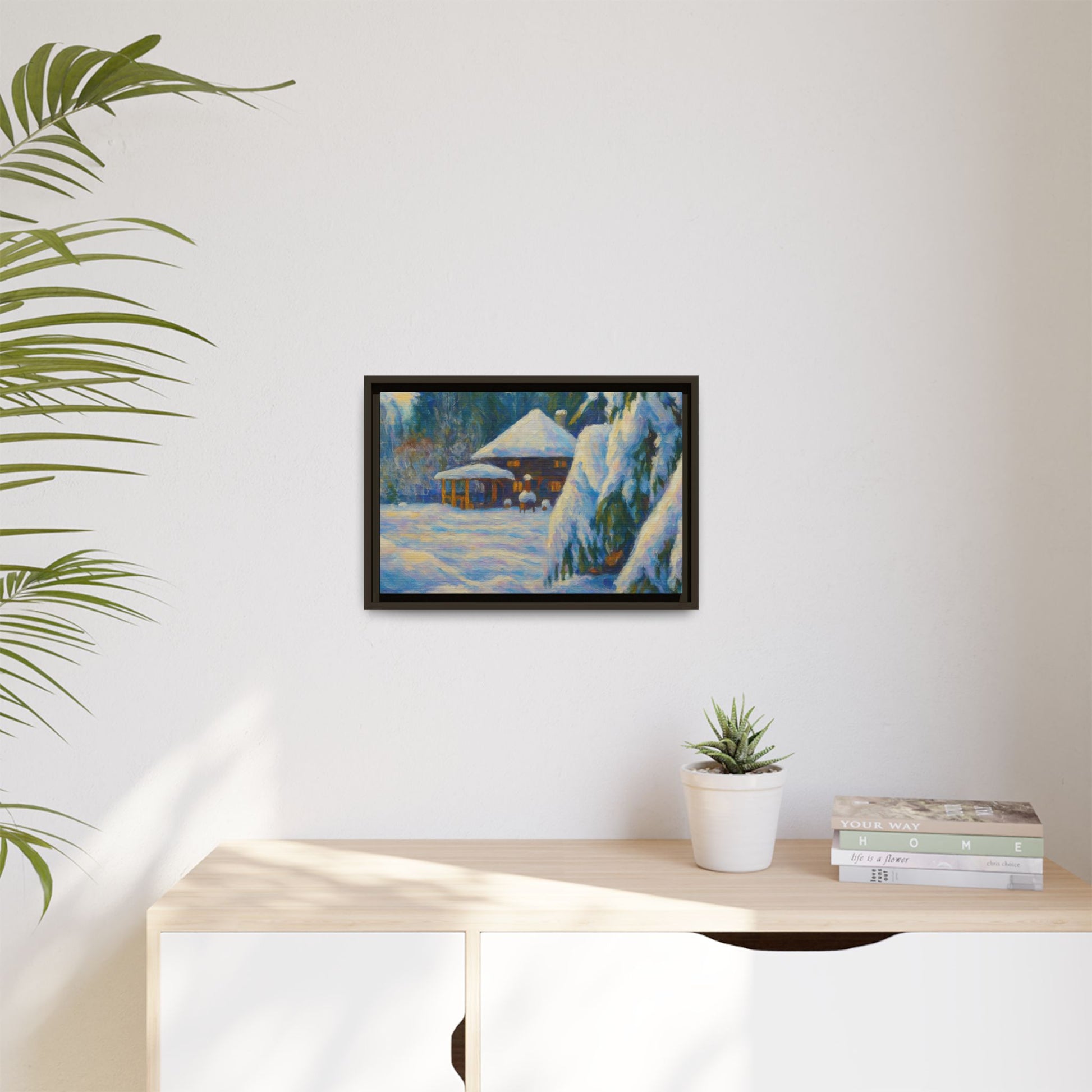 Framed matte canvas print of a snowy cabin winter landscape wall art by Printify featuring a cozy cabin in snow-covered woods.